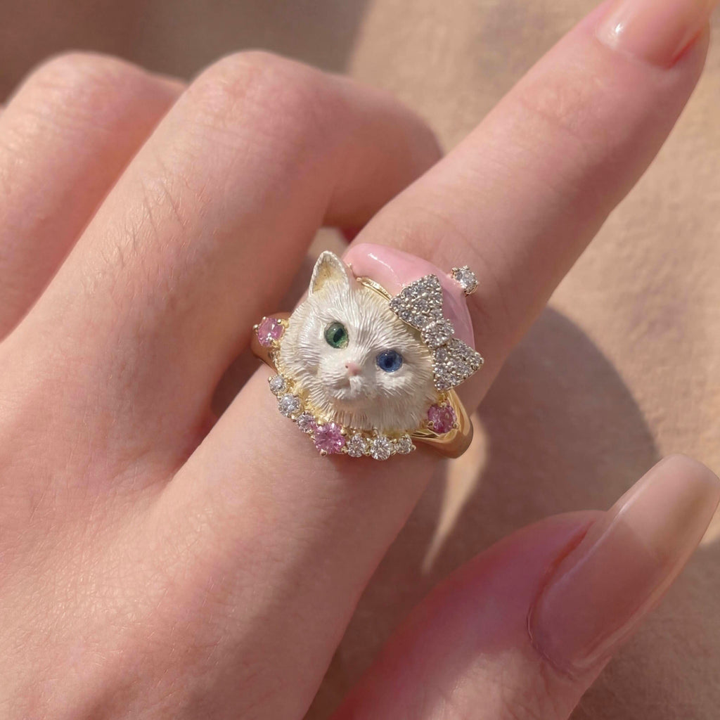 Ring with a cat design on a person's finger