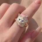 Ring with a cat design on a person's finger