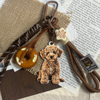 A custom 3D pet relief keychain featuring a detailed hand-painted dog portrait.