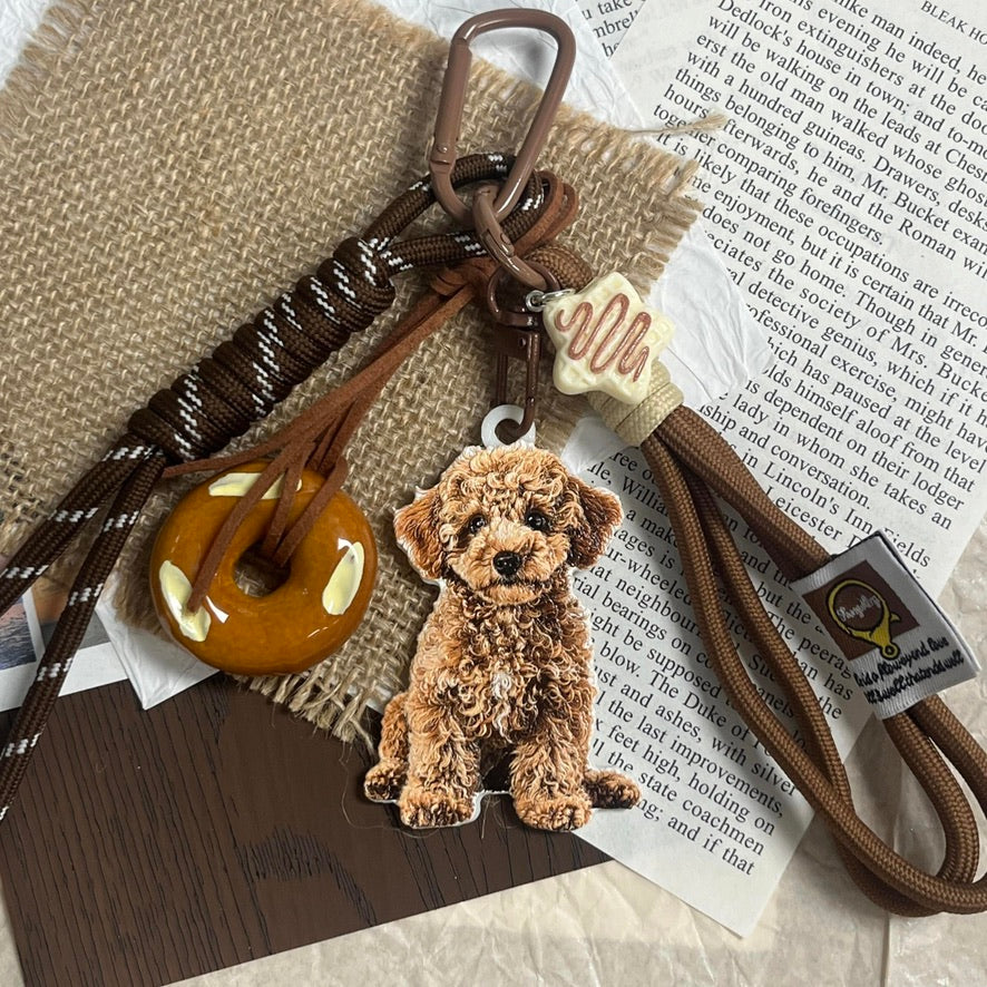 A custom 3D pet relief keychain featuring a detailed hand-painted dog portrait.