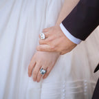 A bride and groom holding hands, showcasing bespoke 3D pet portrait rings custom hand-sculpted as luxury wedding keepsakes to include their pets in the ceremony.