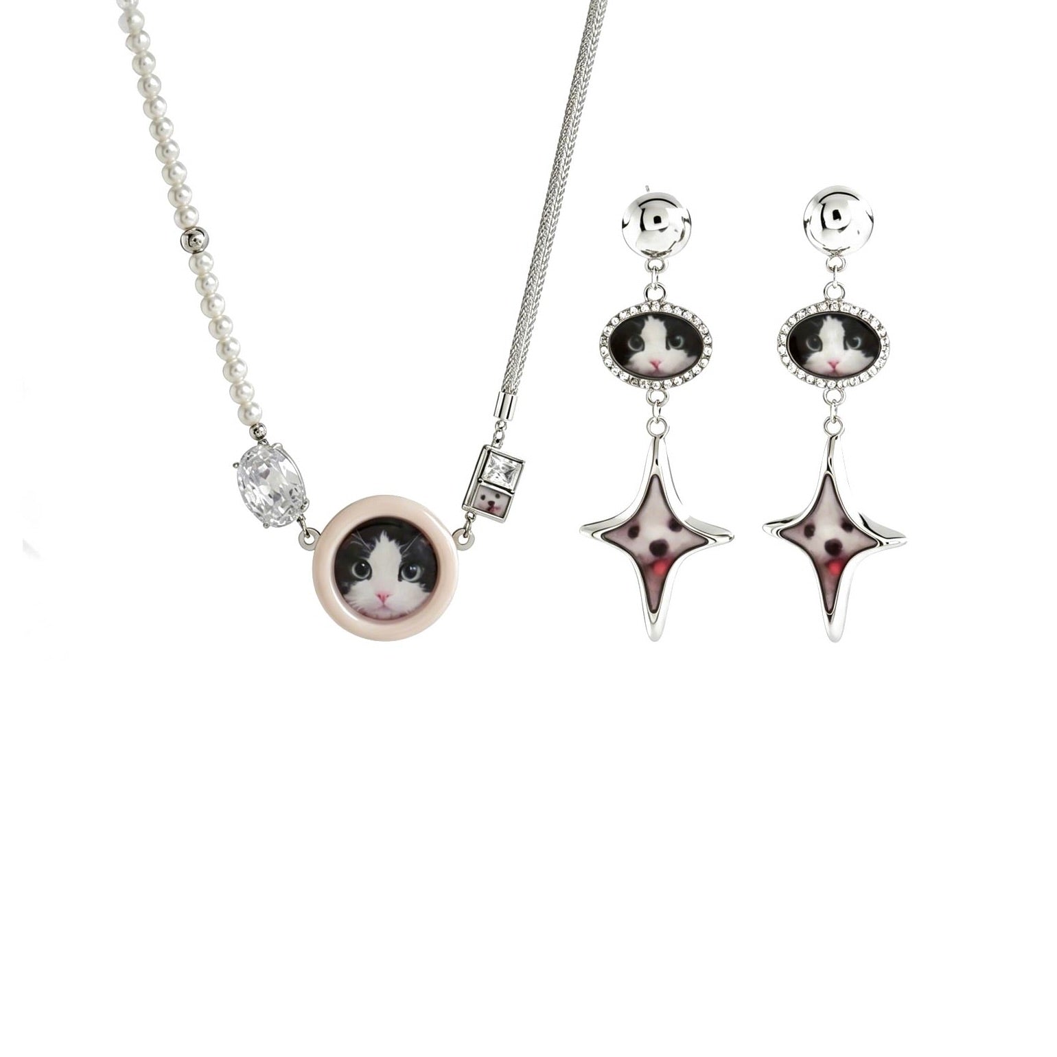 Jewelry set with cat-themed pendant and earrings on a white background
