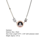 Necklace with a cat pendant on a white background