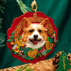 Dog ornament with a wreath design on a green background