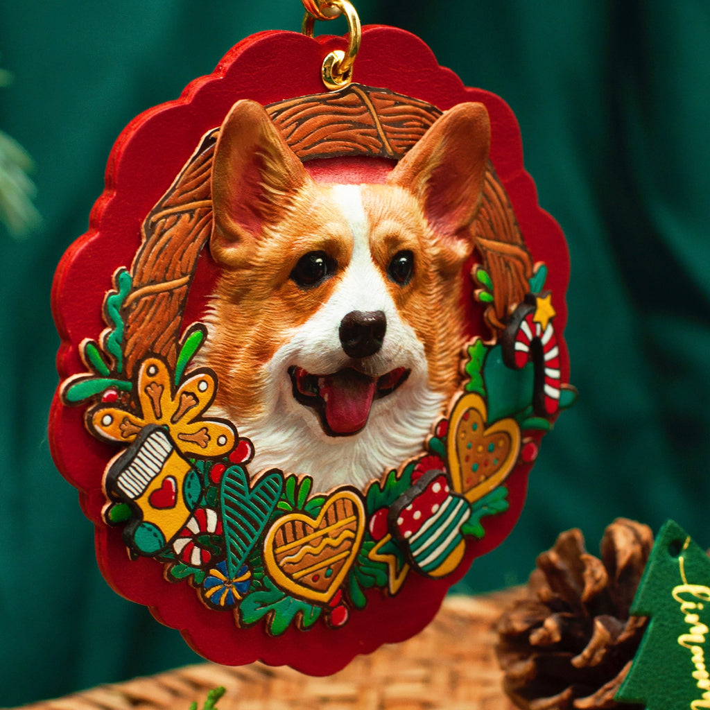 Decorative Christmas ornament with a corgi dog design on a red background.