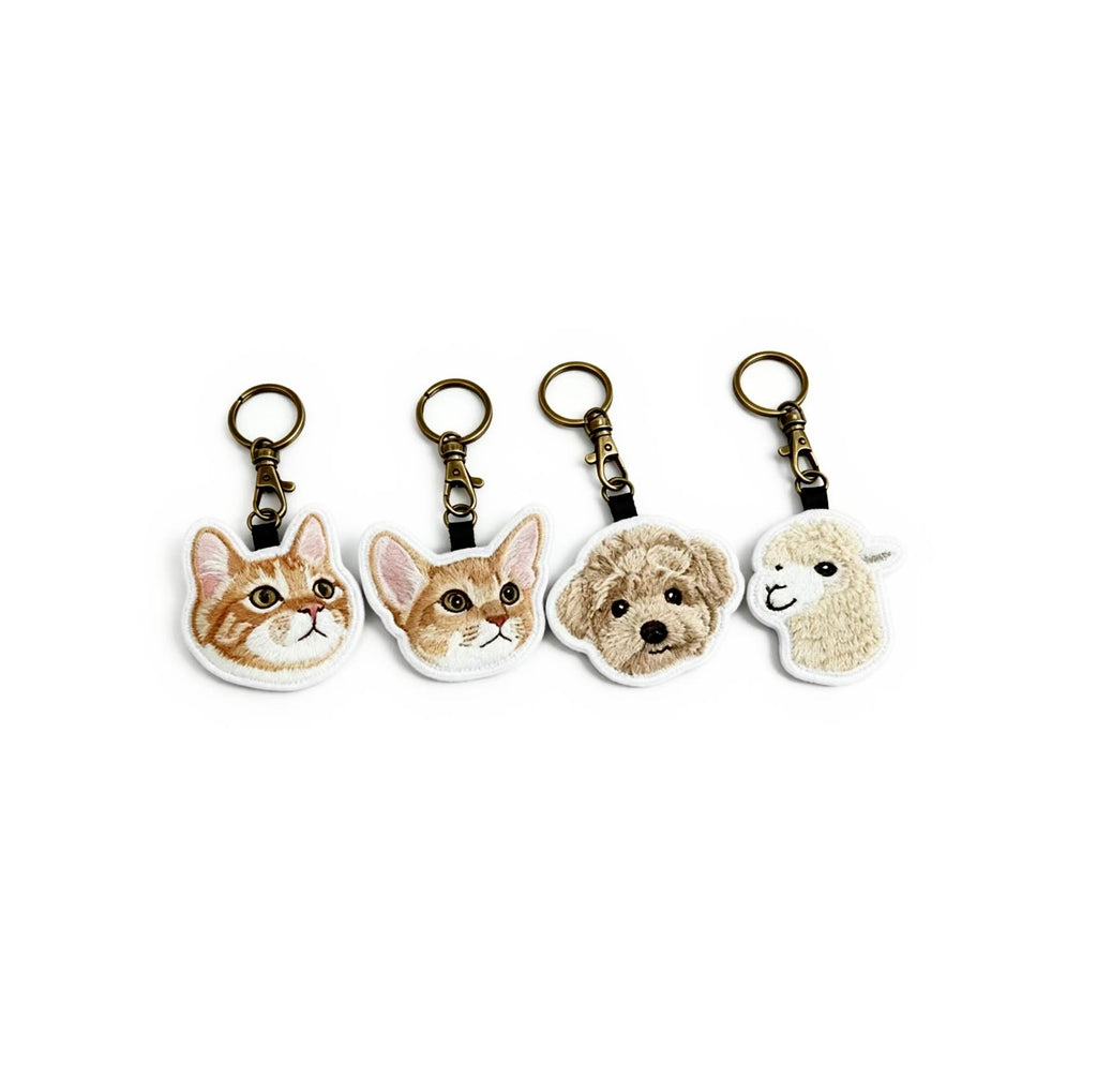 Four animal-themed keychains on a white background