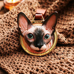 Cat-shaped pendant on a textured fabric background