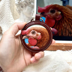 Hand-painted 3D leather relief keychain featuring a hyper-realistic rooster portrait with vibrant red comb and textured feathers.