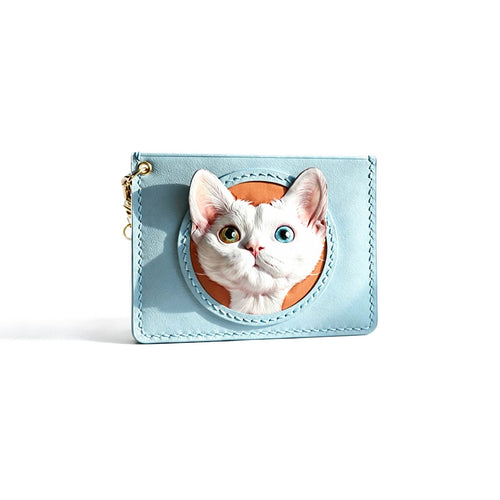 Light blue cardholder with a cat design on a white background