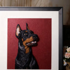 Framed artwork of a dog's head on a red background