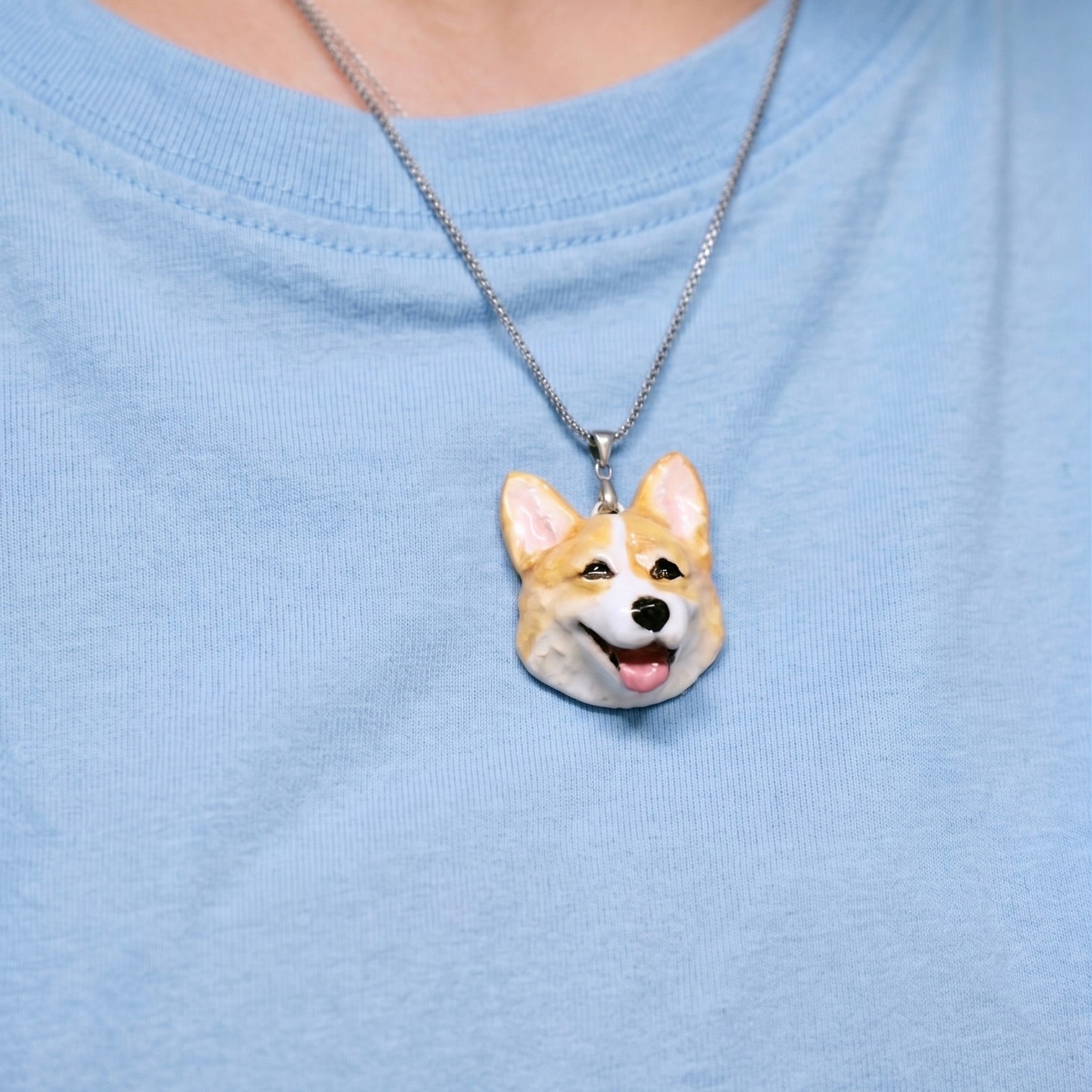 Custom sterling silver custom 3D pet portrait pendant necklace of a Corgi on a model, daily wearable art.