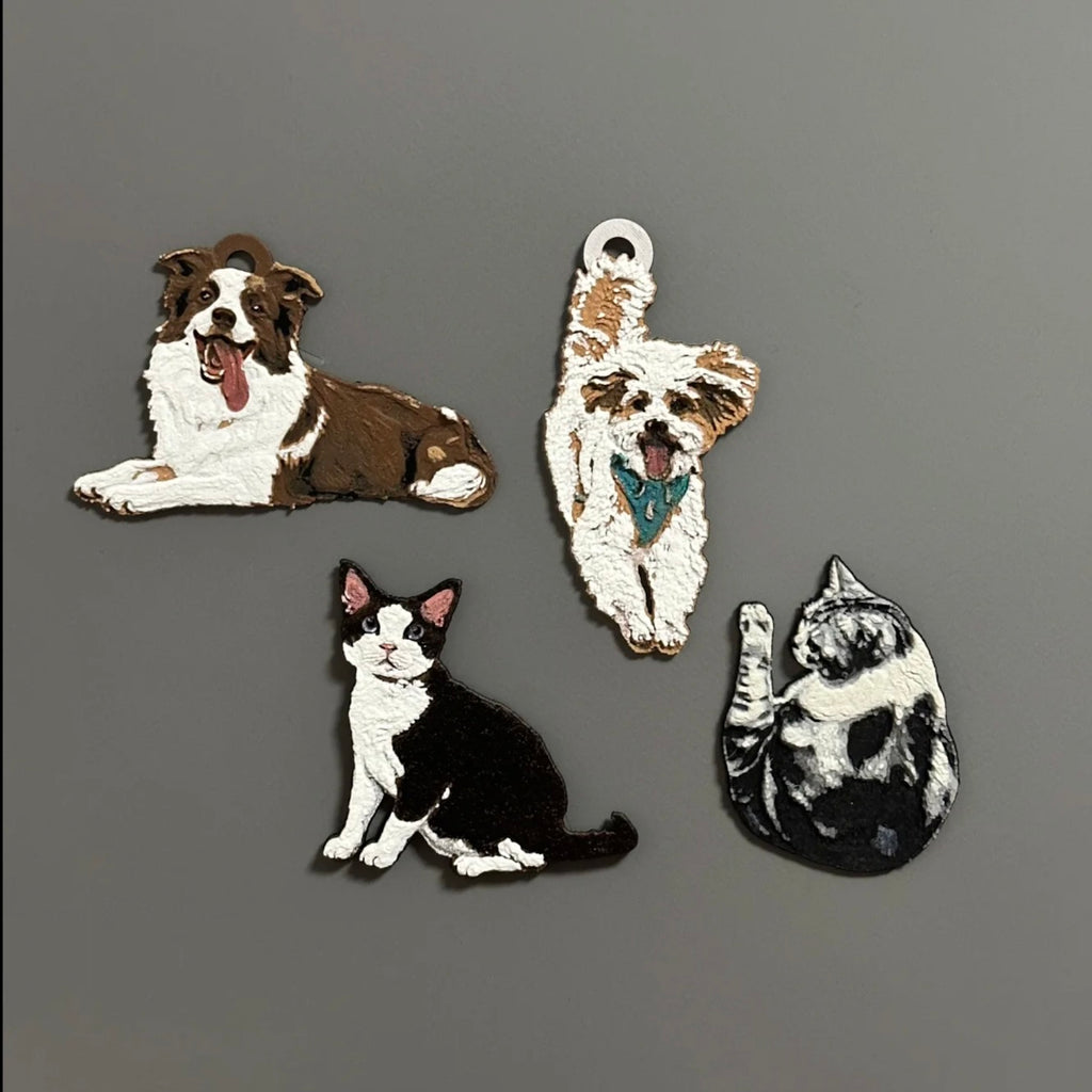 Four dog and cat figurines on a gray background