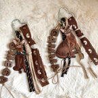 Two decorative keychains with cat illustrations and text on a soft white background