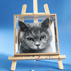 Painting of a gray cat on an easel against a blue background
