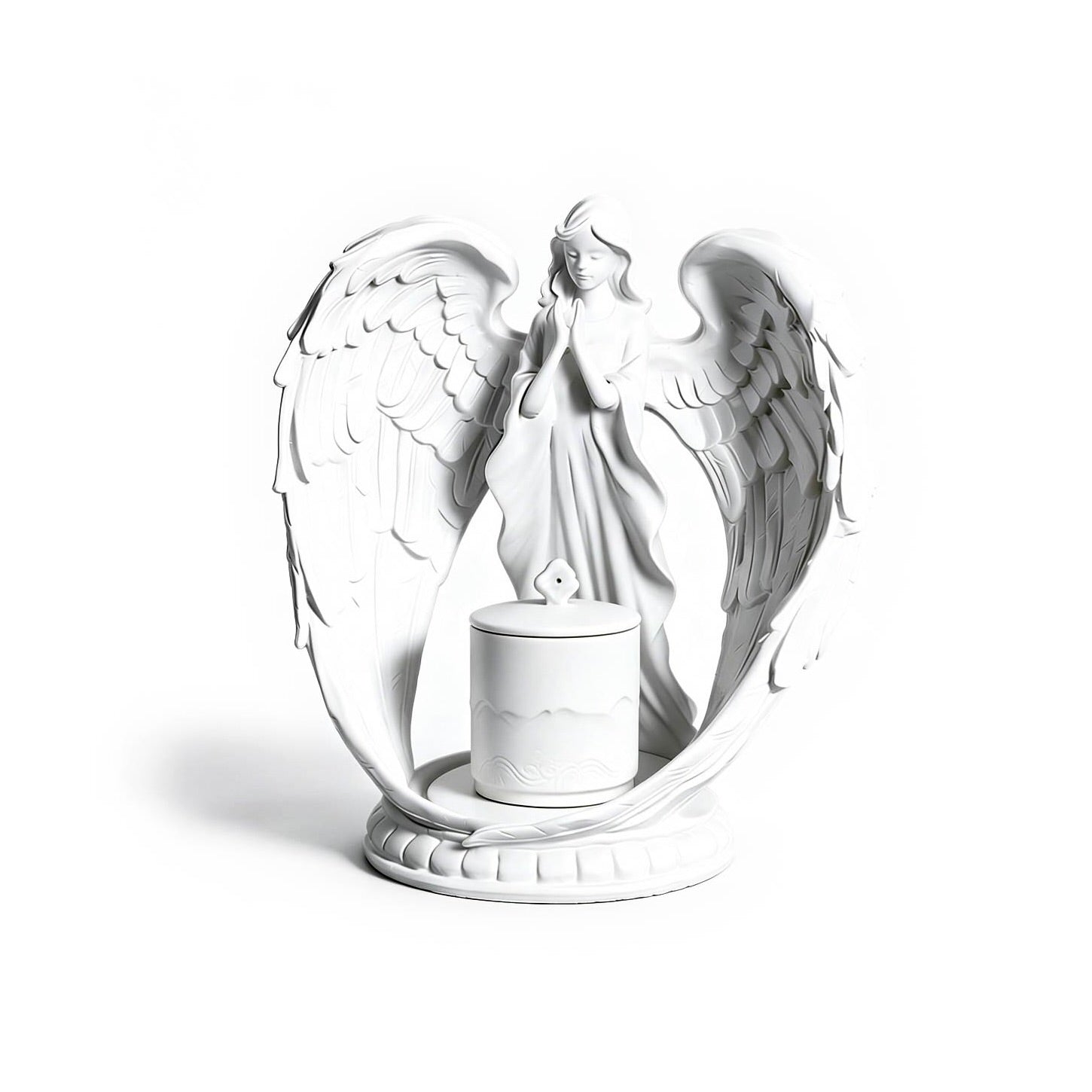 White angel figurine with wings spread holding a candle on a white background