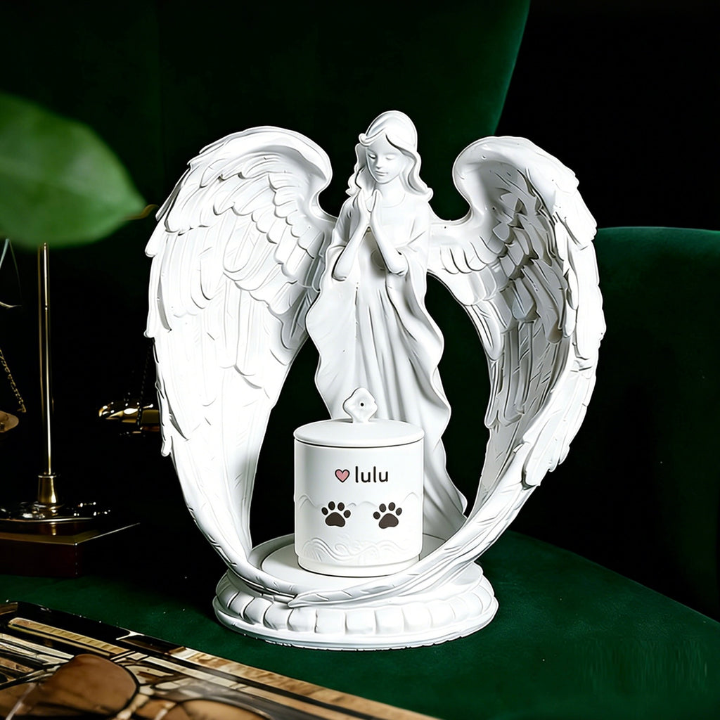 White angel statue with a small container on a dark surface