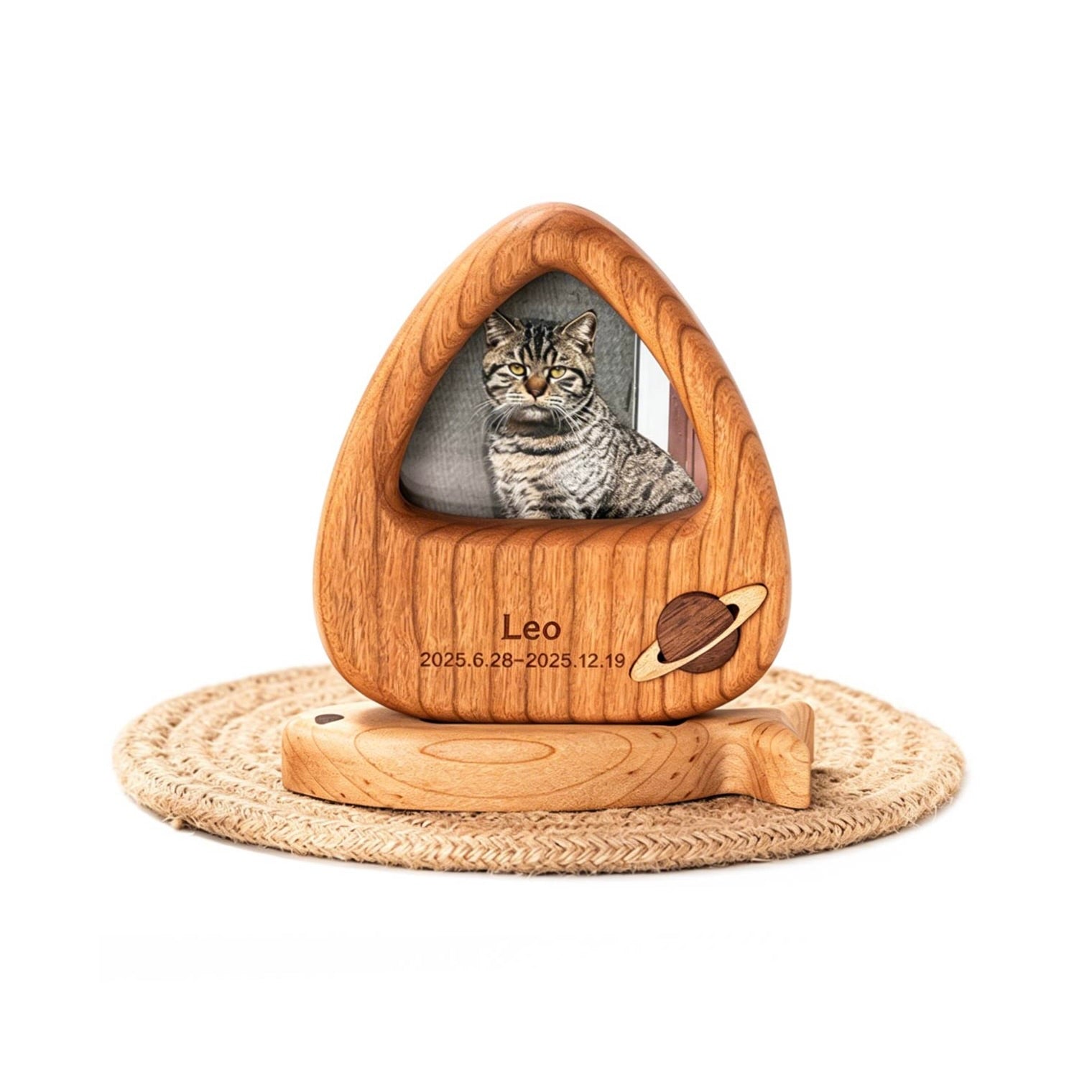Wooden pet urn with a cat's photo and engraved details on a white background
