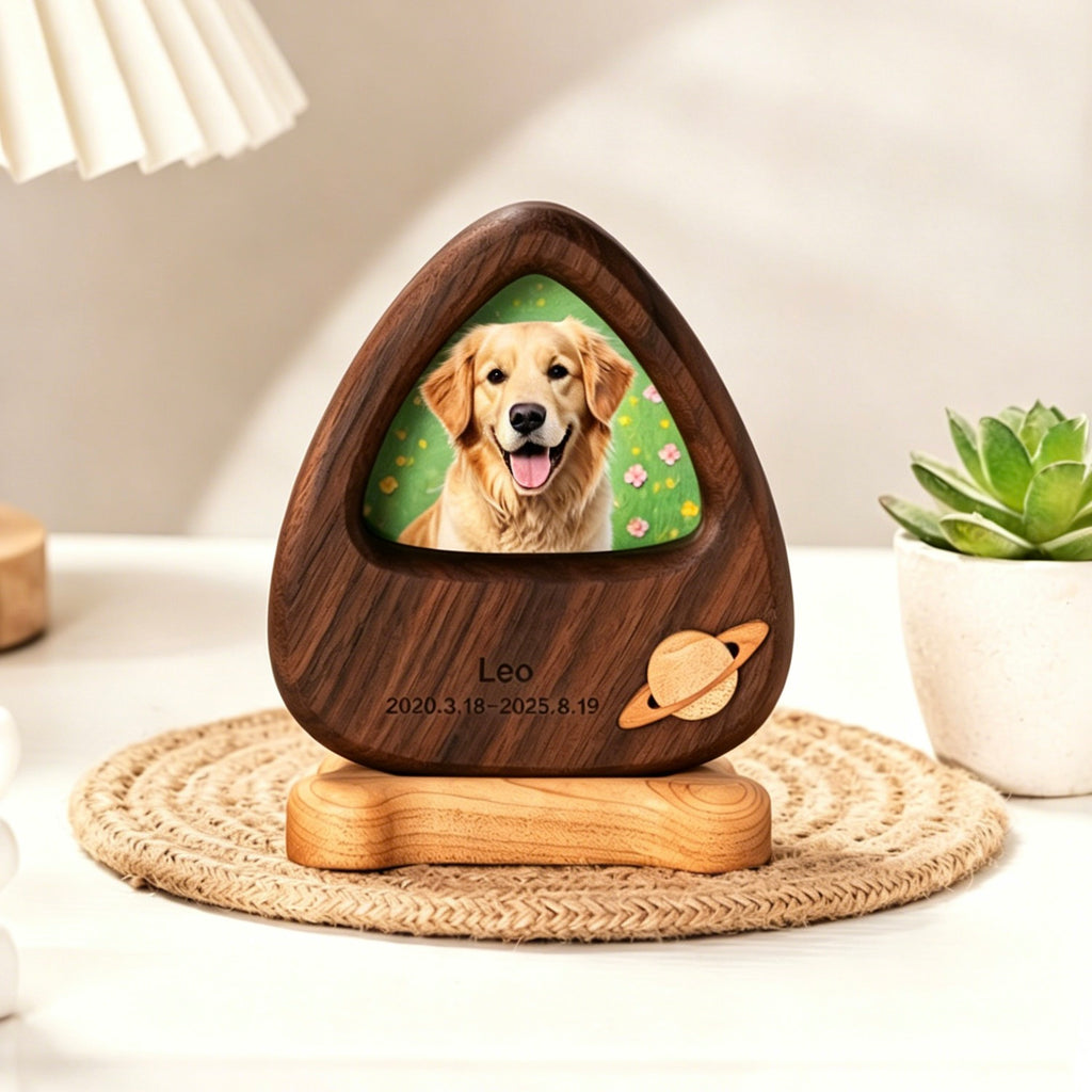 Wooden pet memorial with a photo of a dog on a table with a lamp and plant in the background.
