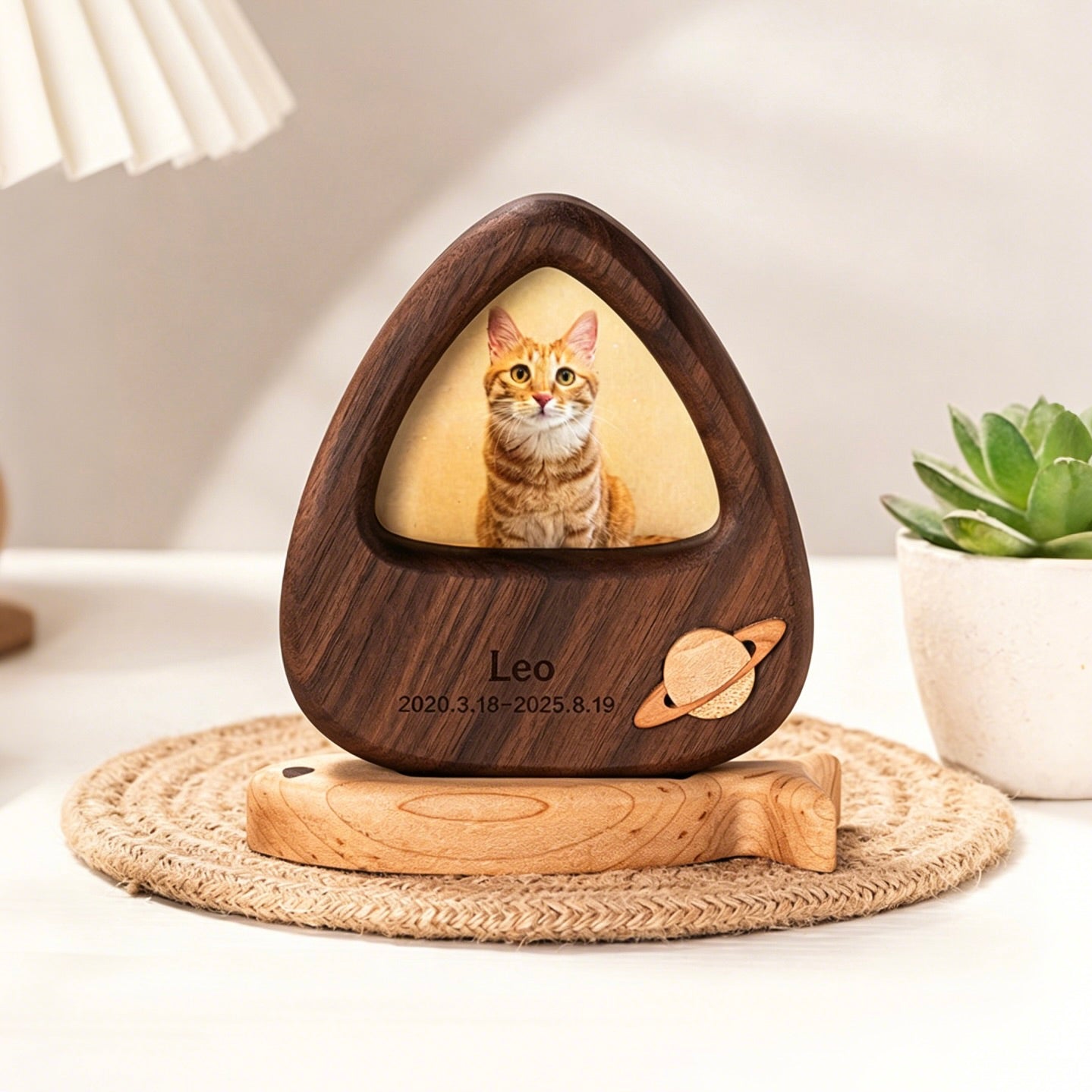 Wooden photo plaque with a cat's face on a wooden stand, featuring the name 'Leo' and dates.