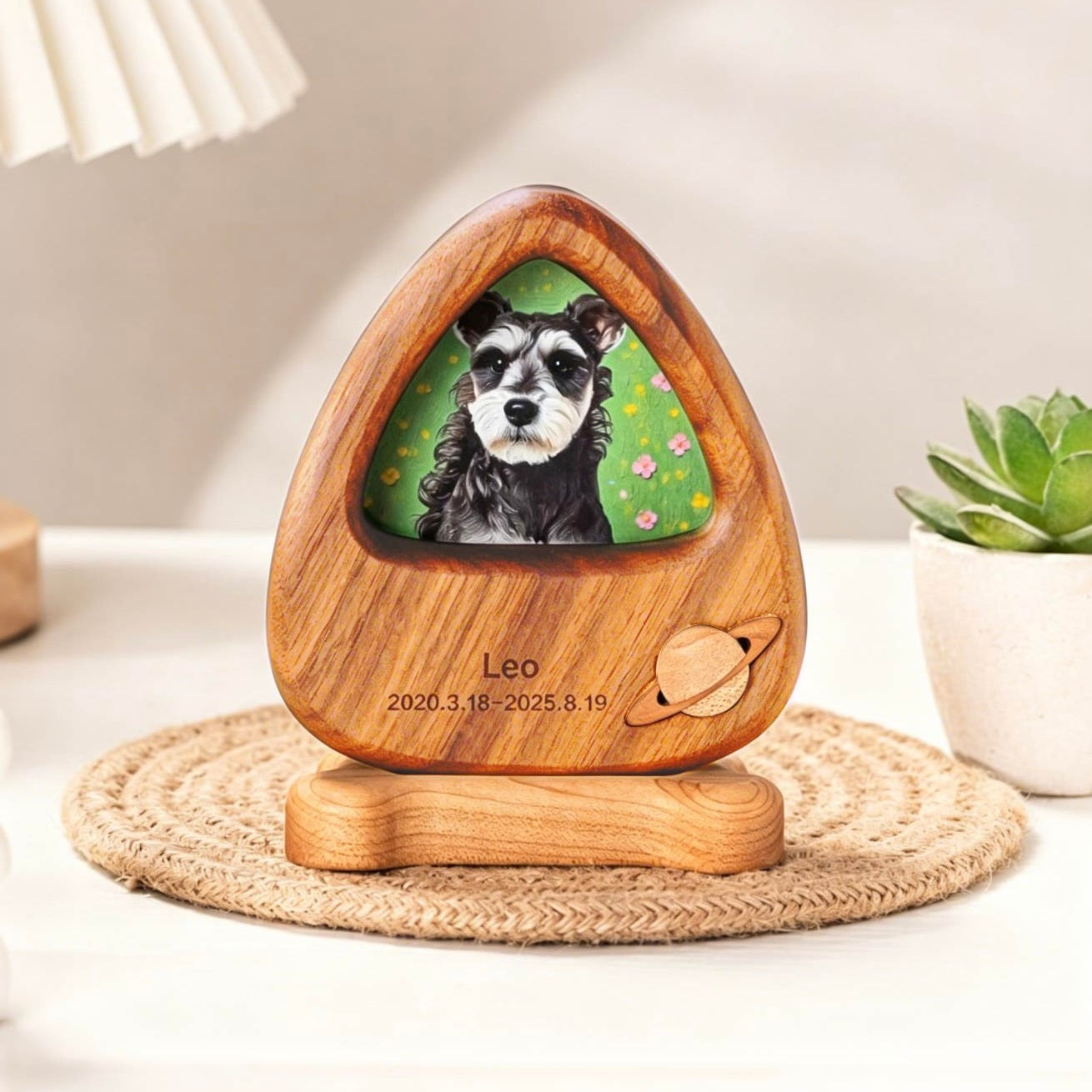 Wooden pet memorial with a photo of a dog and engraved text on a white surface.