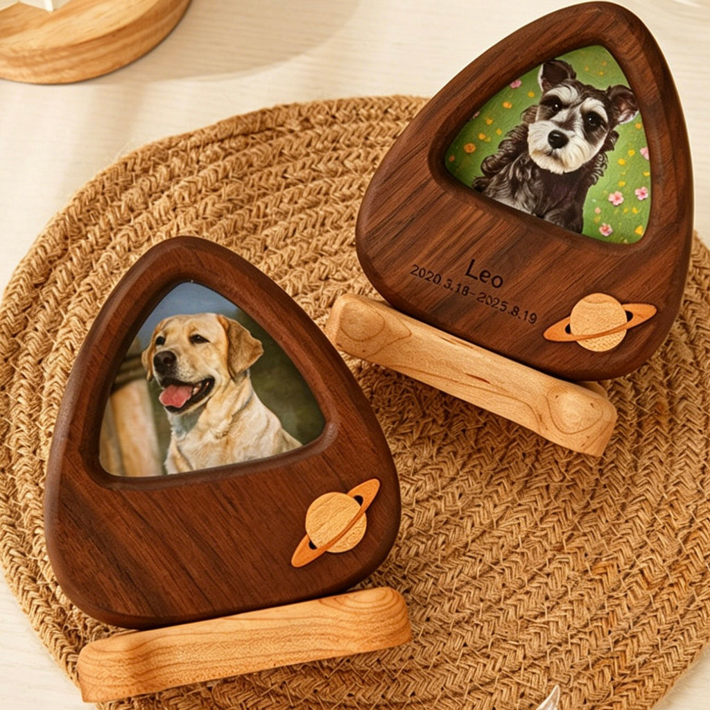 Two wooden pet memorials with engraved names and dates, featuring images of dogs on a woven mat.