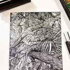 Black and white illustration of a parrot on a notebook cover with drawing tools.