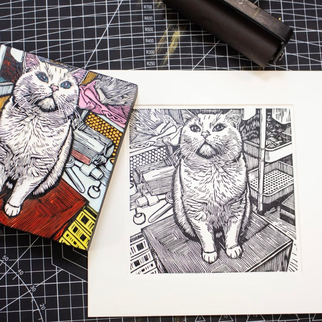 Illustration of a cat on a piece of paper with a grid background