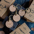 Keychains with animal designs on a blue textured surface with 'Mountain Rock' packaging.