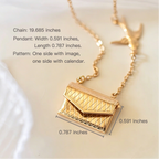 Gold necklace with a geometric pendant on a light background