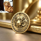 Bronze medallion with a dog's face wearing glasses on a reflective surface.