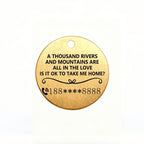 Gold pendant with engraved text on a white background