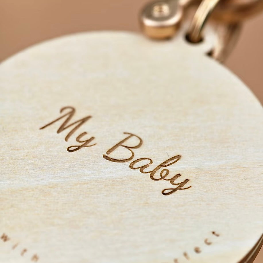 Pet loss remembrance keepsake showing engraved dates on back of wooden charm