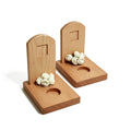 Wooden bookends with floral design on a white background