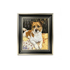 Framed painting of a brown and white dog on a yellow blanket