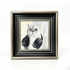 Framed artwork of a cat wearing headphones on a white background