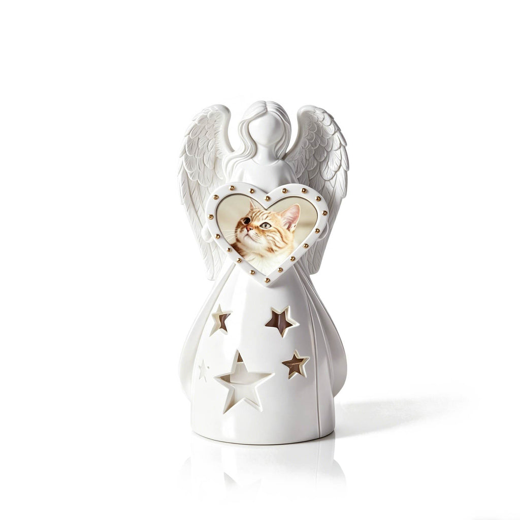 White angel figurine with a heart-shaped window featuring a cat's face on a white background