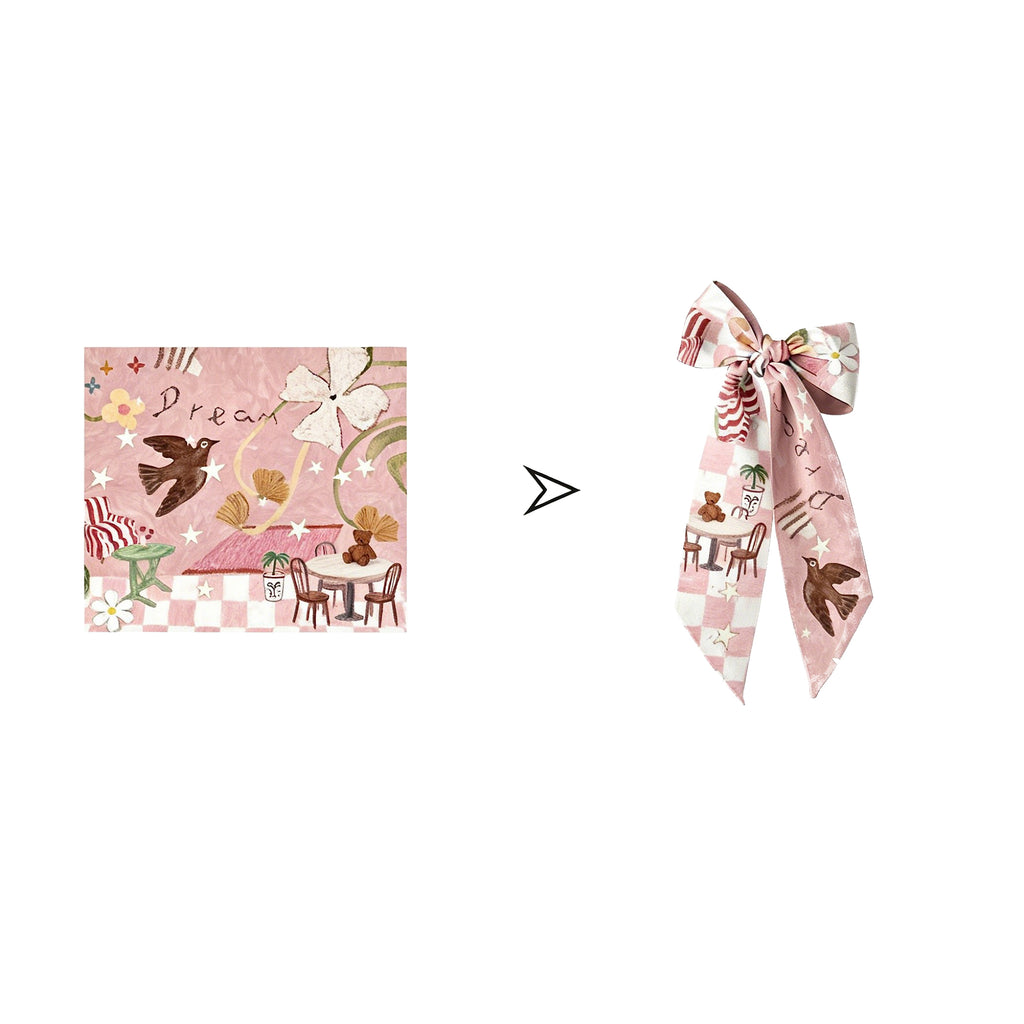 Pink scarf with decorative design on a white background