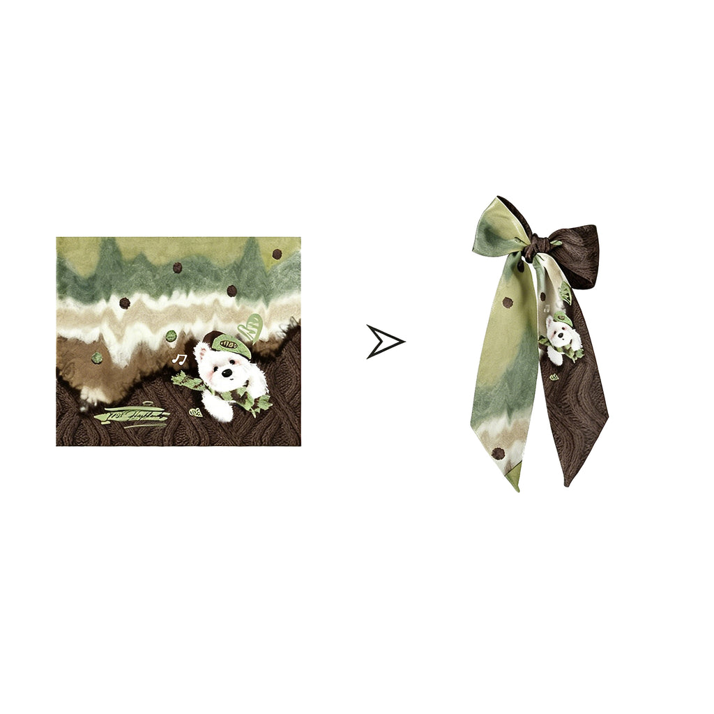 Green and brown patterned fabric with a panda design on a white background