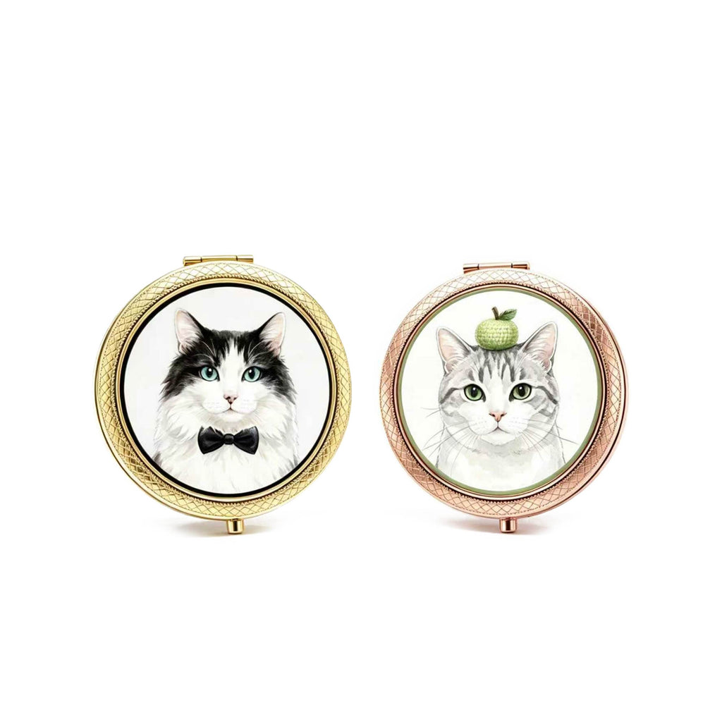 Two compact mirrors with cat illustrations on a white background