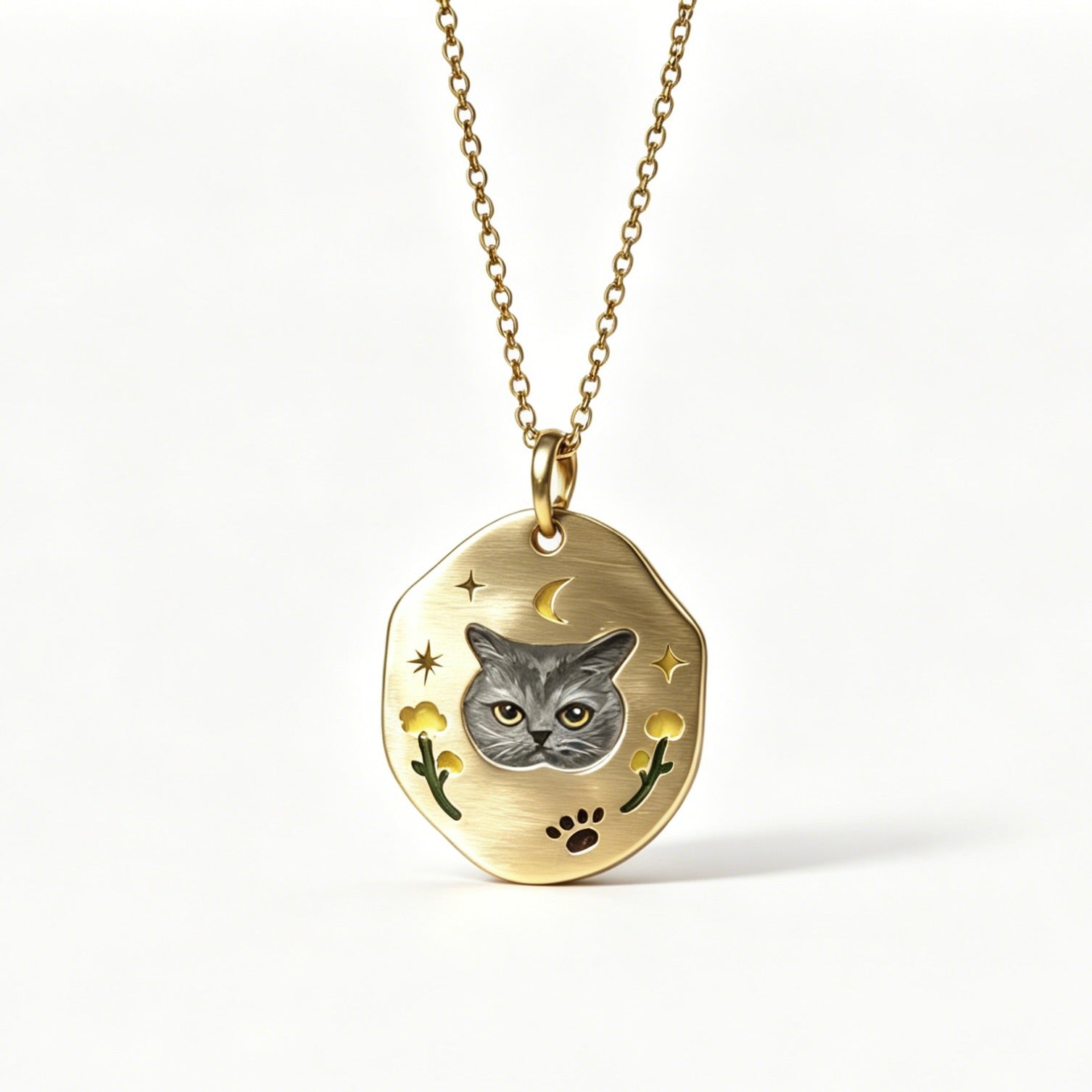 Gold necklace with a pendant featuring a cat's face on a white background
