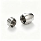 Two metallic earplugs on a white background