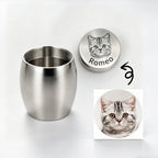 Stainless steel cup with engraved lid featuring a cat's face and name 'Romeo' on a white background.