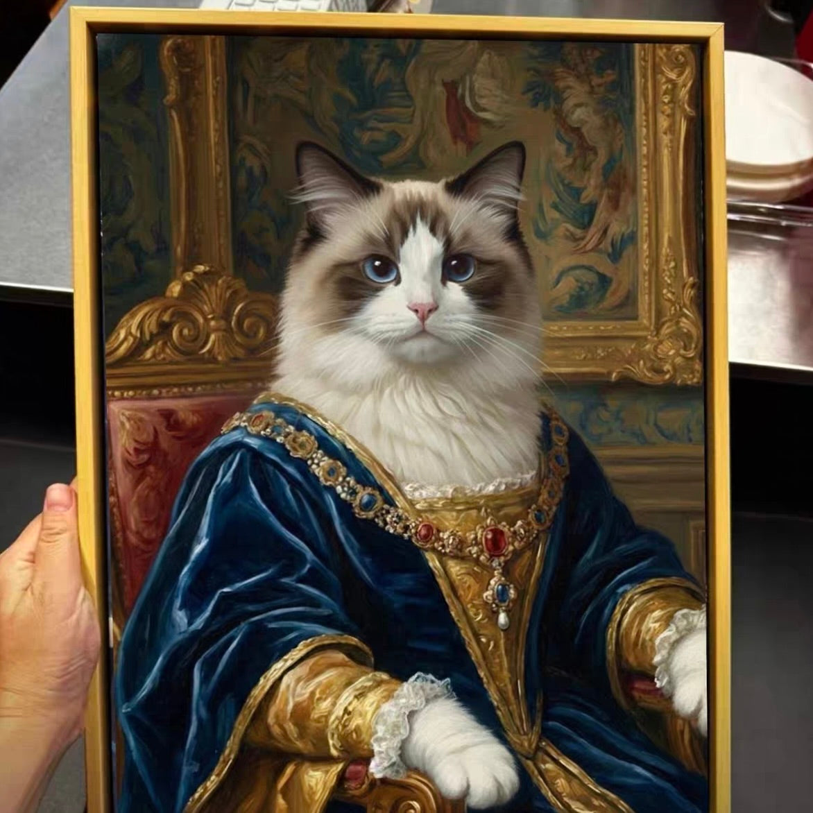 Cat in regal attire with a gold and blue robe, framed like a classical painting.