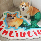 Dog with a mermaid tail standing on a rug with a similar design