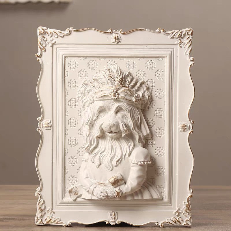 Decorative wall art with a stylized portrait of a bearded figure in an ornate frame.