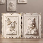Decorative wall art with animal portraits in ornate frames.