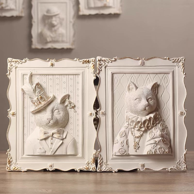 Decorative wall art with animal portraits in ornate frames.
