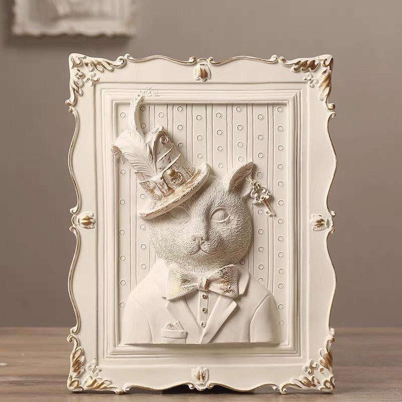 Decorative wall art of a rabbit in a suit and top hat with an ornate frame.
