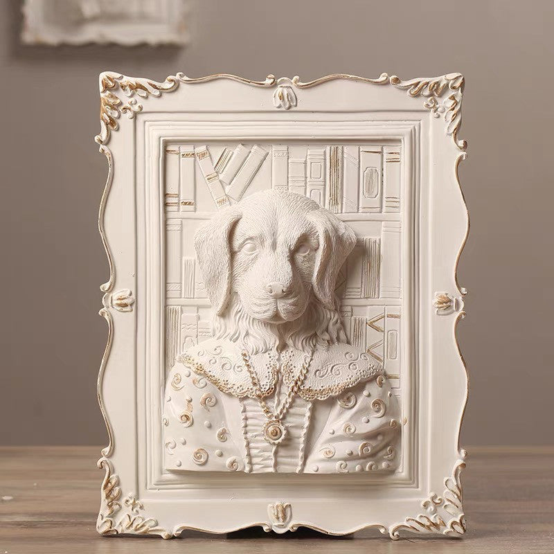 Decorative wall art of a dog in a decorative frame on a wooden surface.