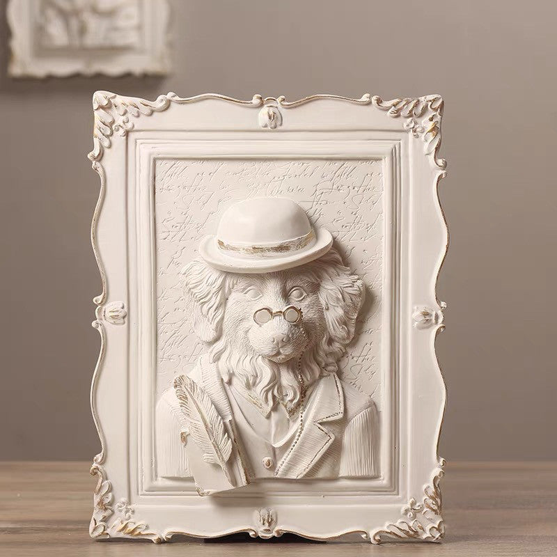 Decorative wall art of a lion wearing a hat and coat in an ornate frame.